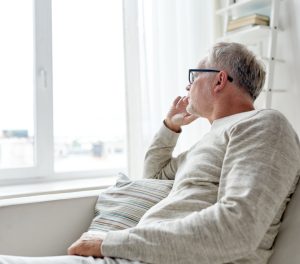 man looking out the window